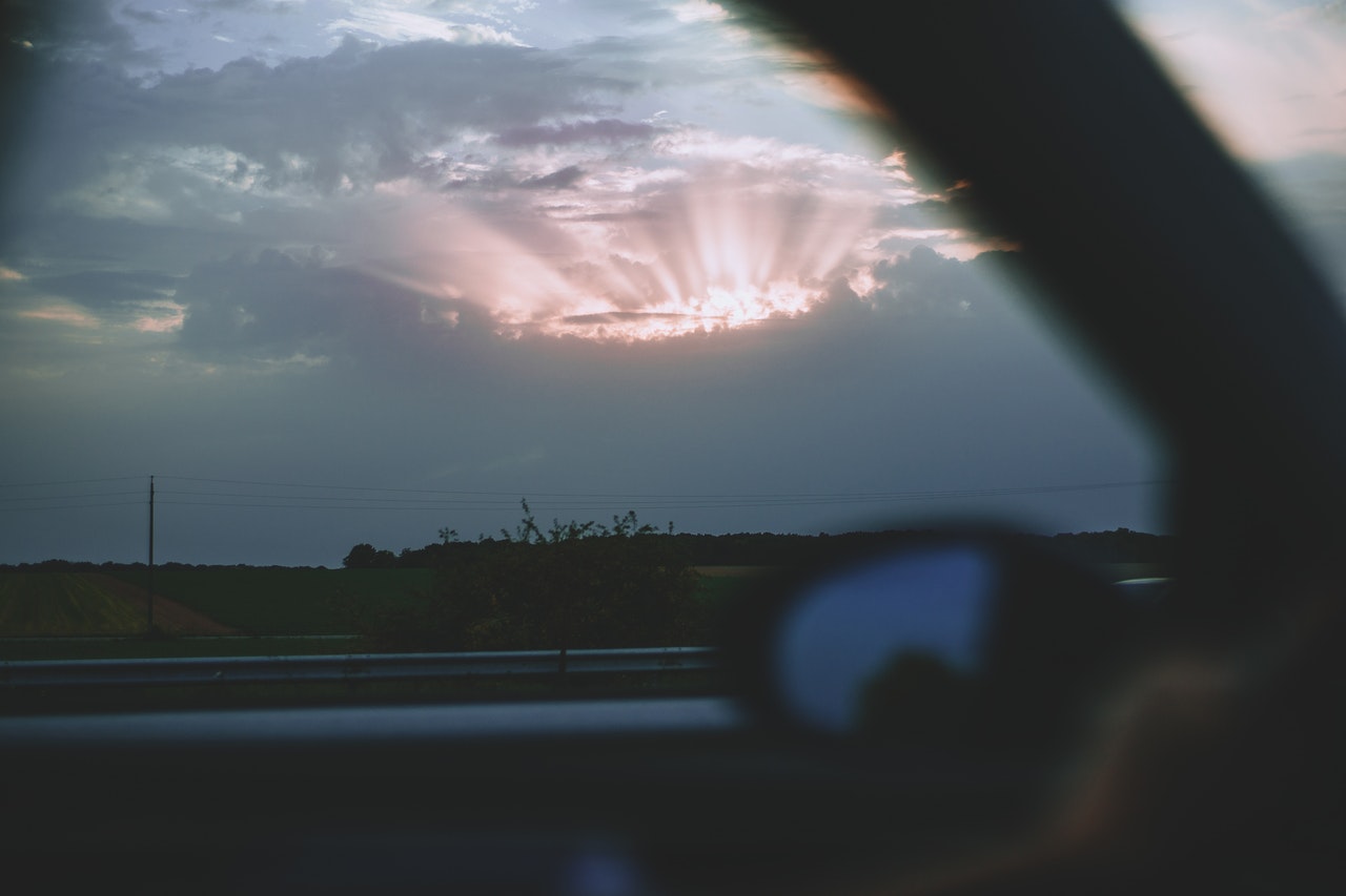 Clouds breaking view from car