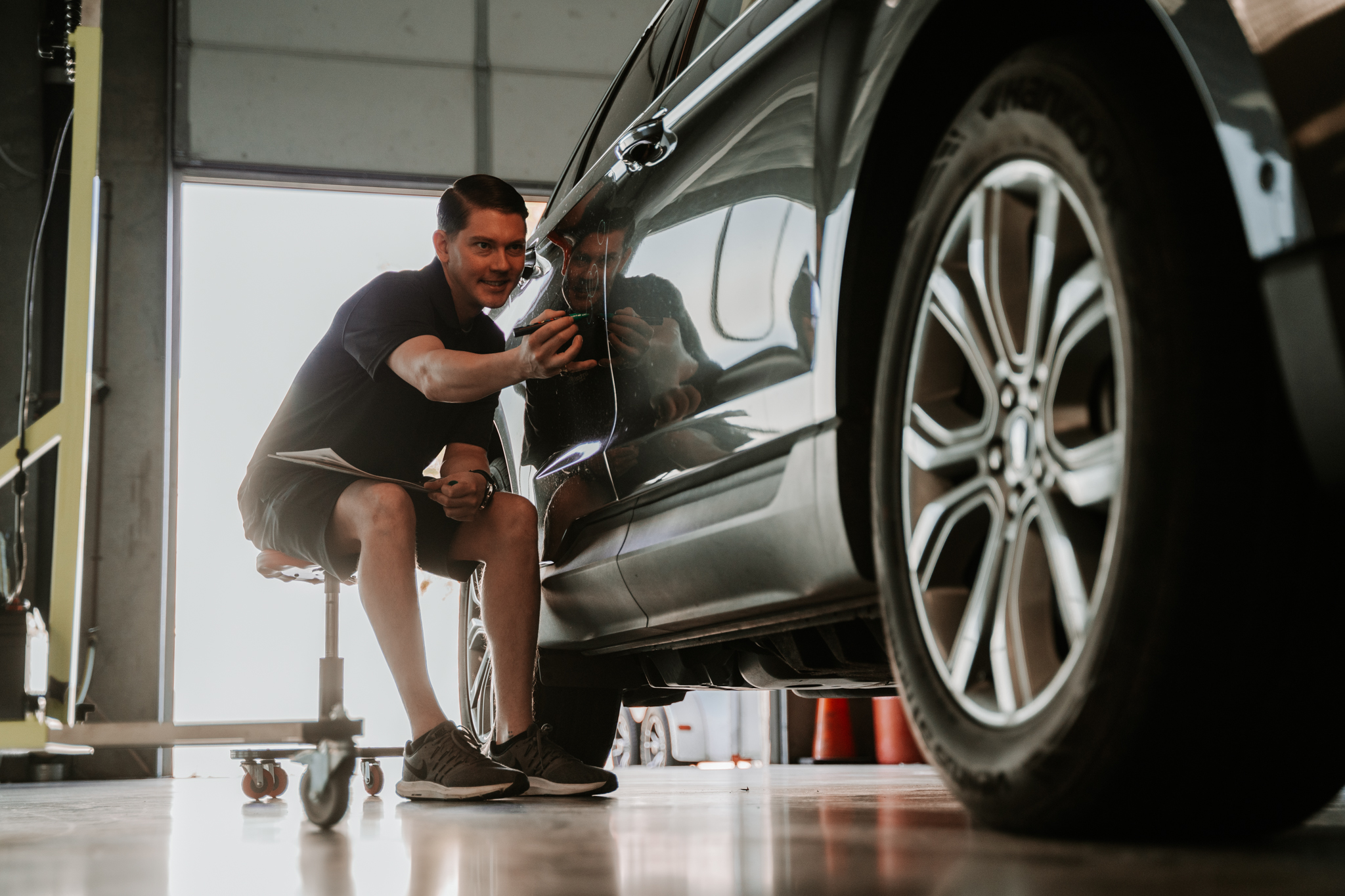 Repairing dents on hood of car